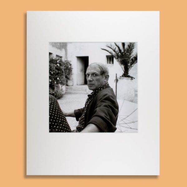 Photograph of Picasso sat outside Hotel in France