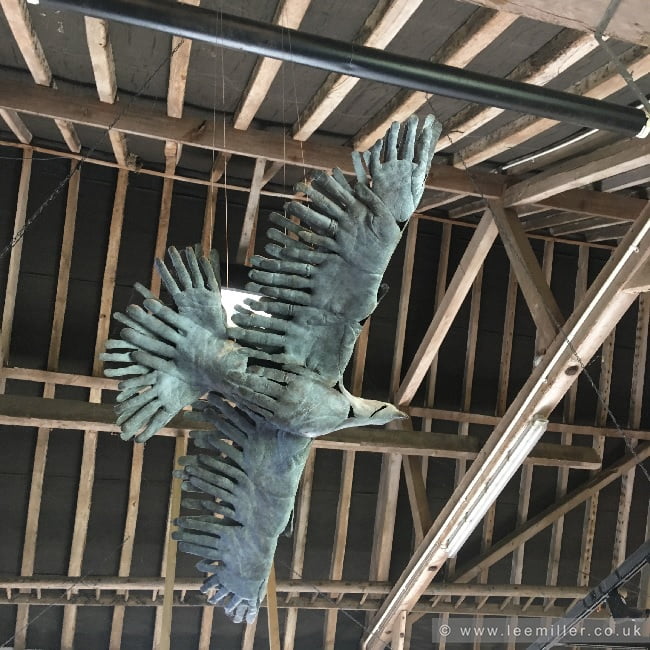 Suspended bird made from moulded hands